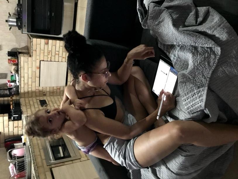 A person holding a childDescription automatically generated