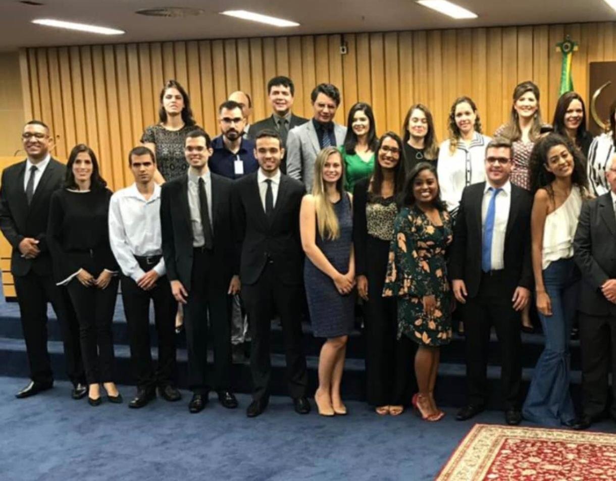 A group of people posing for a photo

Description automatically generated